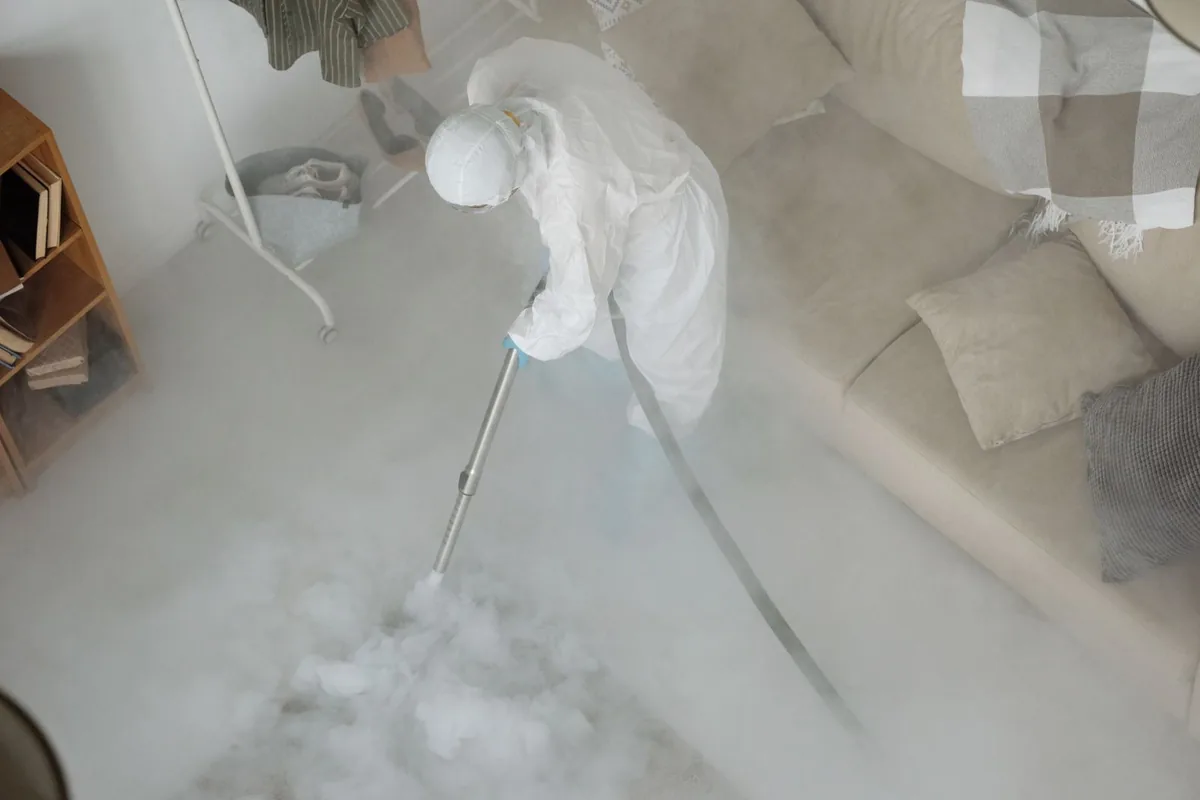 Biohazard cleanup technician in protective equipment, Seeley Lake, MT